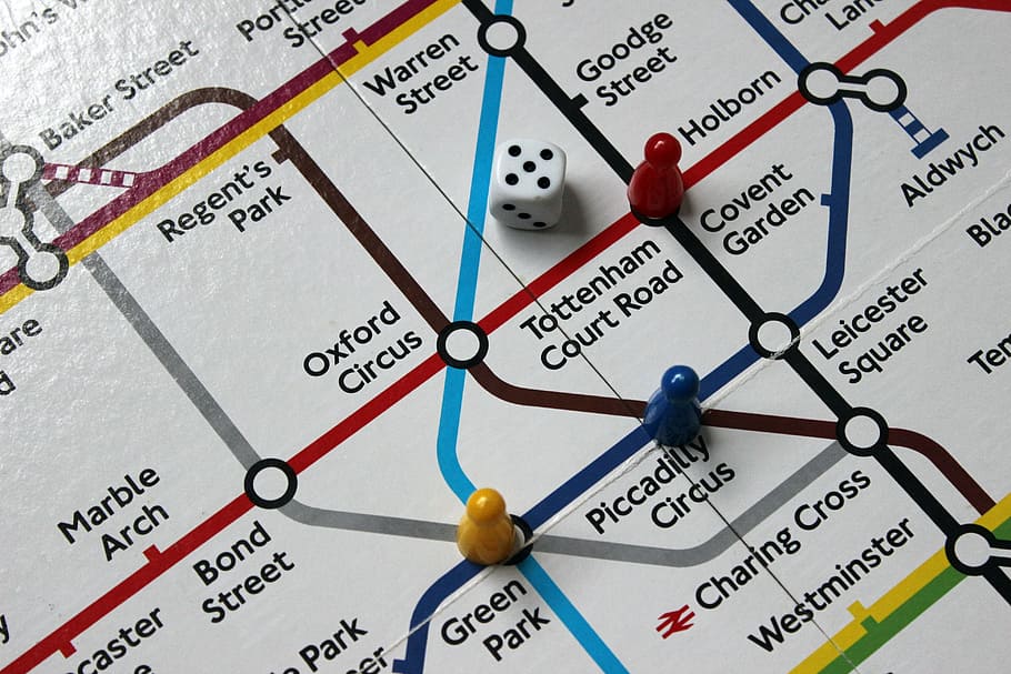 white dice on map, underground, tube map, stations, board game