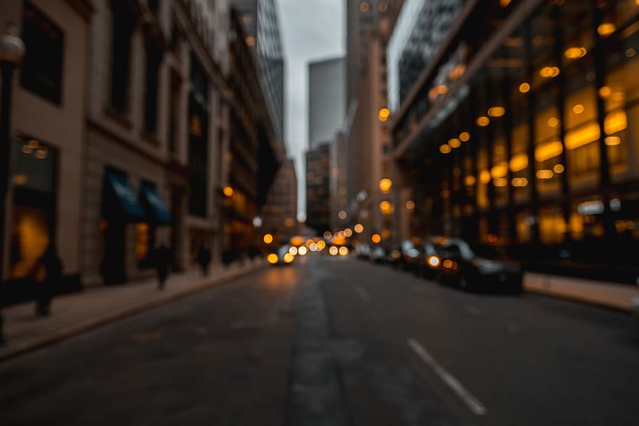 asphalt street road, road with cars in between in buildings, blur