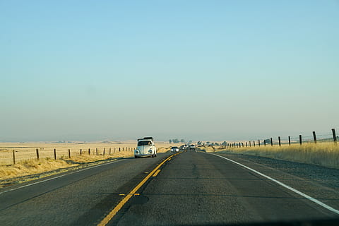 white car on concrete road, white Volkswagen beetle on road during daytime HD wallpaper