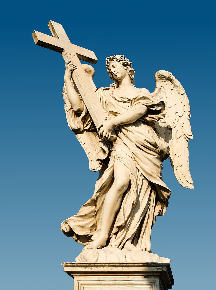 angel holding cross statue during clear blue sky, the angel with the cross