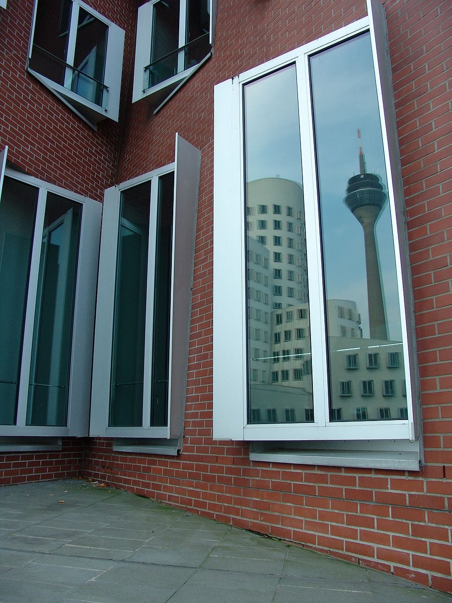 facade, glass facade, skyscraper, mirroring, glass window, discs HD wallpaper