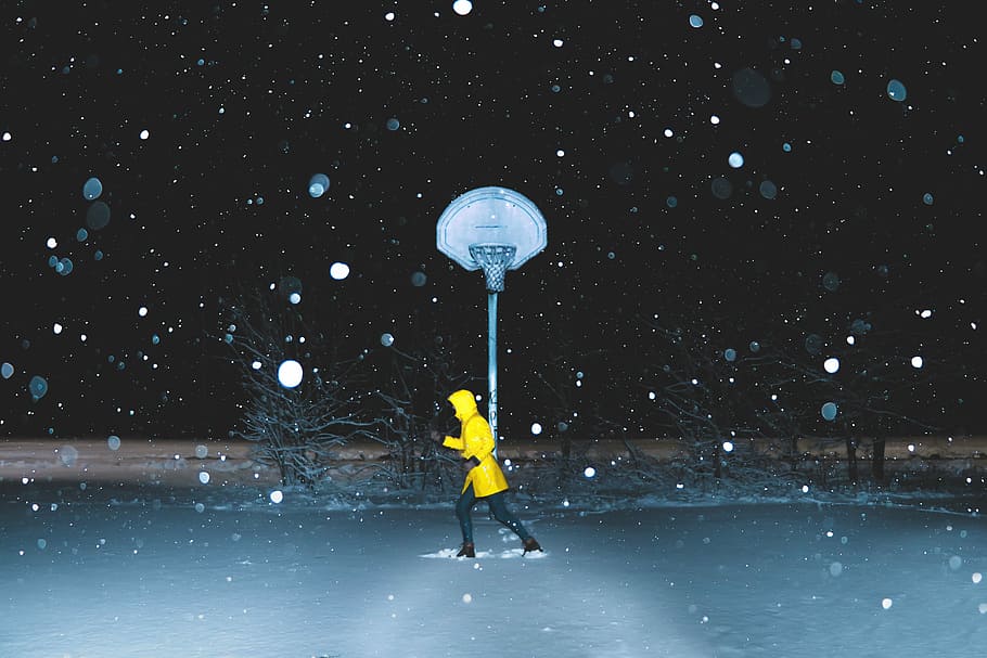 man running on body of water during winter season, person running under basketball hoop HD wallpaper