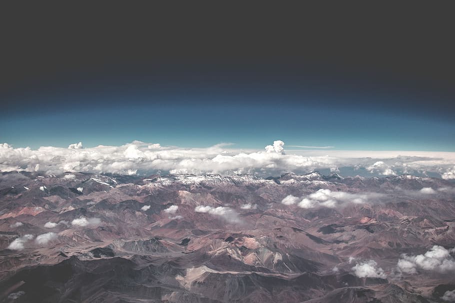 arial view of mountains with clouds, aerial view of brown mountains