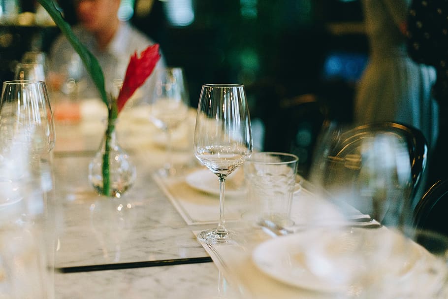 selective-focus photography of wine glass on table, clear wine glass HD wallpaper