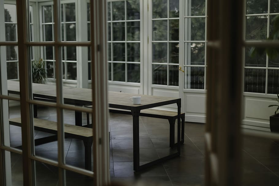 brown wooden table beside glass paneled wall, white ceramic teacup on wooden table HD wallpaper