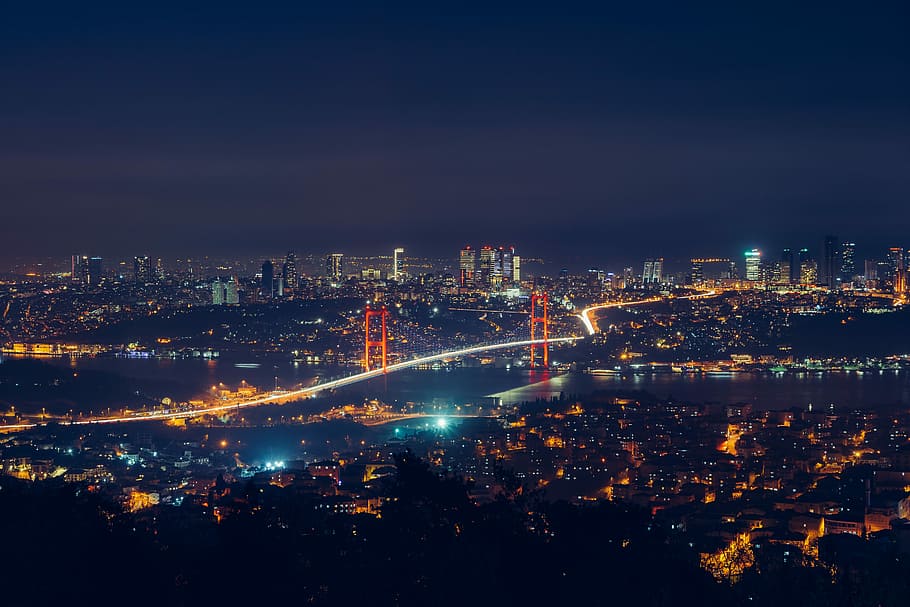 aerial view of city skyline under black sky during nighttime HD wallpaper