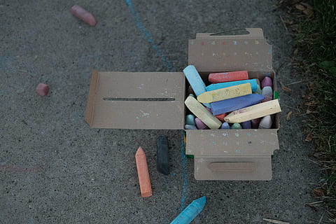 assorted-color chalks in brown cardboard box, crayons, pavement HD wallpaper