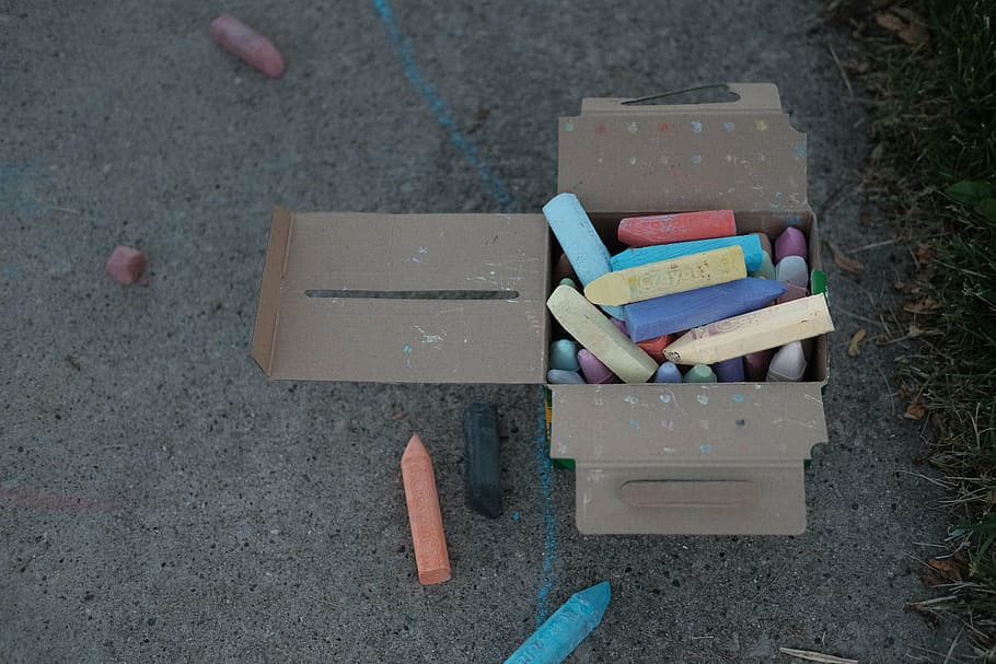 assorted-color chalks in brown cardboard box, crayons, pavement HD wallpaper