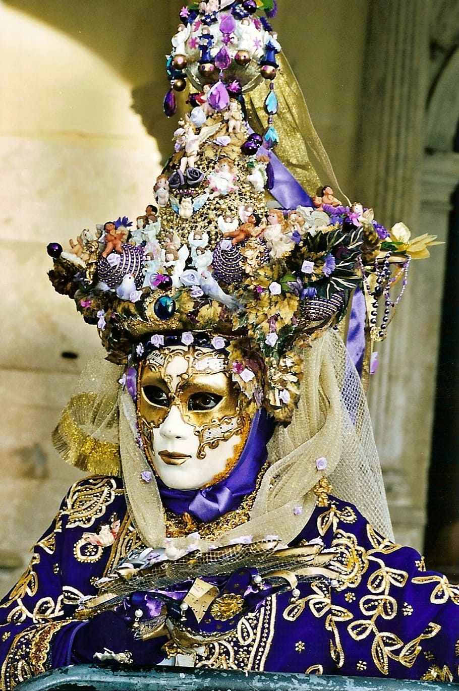 person wearing purple masquerade mask with ornaments, face, clothing