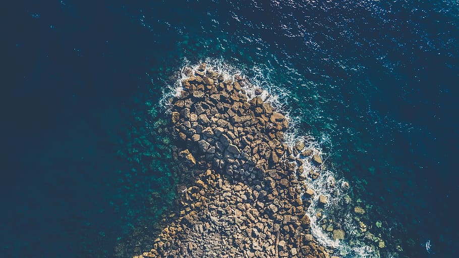 aerial view photography of brown rocks beside ocean, seashore, HD wallpaper