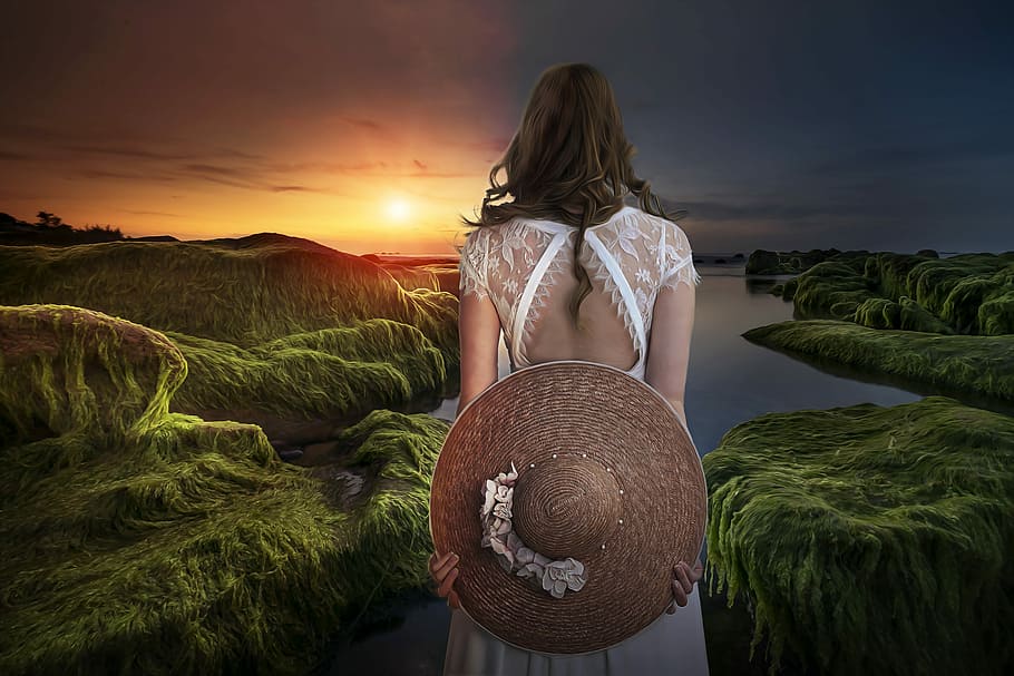 woman wearing white laced cap-sleeved dress facing mountains while holding sun hat HD wallpaper