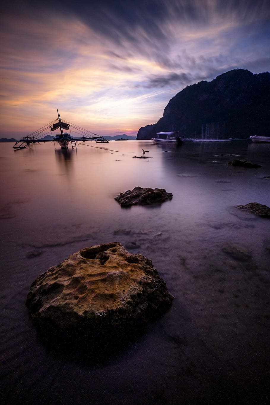 boat near boulders and hills, boat near shore, rock, water, sunset HD wallpaper
