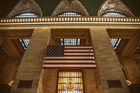 Interior shot containing USA flag taken at Grand Central Station in Manhattan, New York City HD wallpaper
