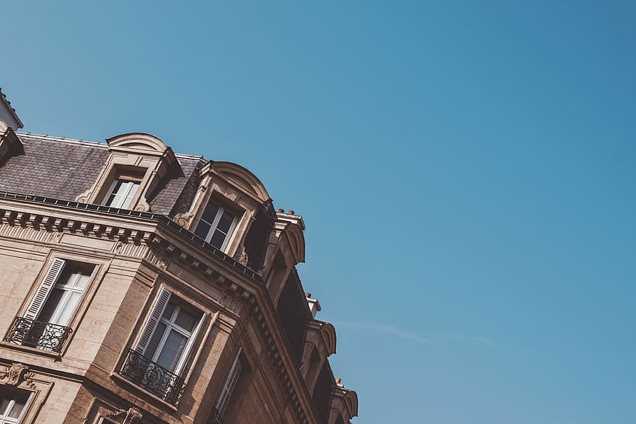 low angle photography of brown building during daytime, photo of beige concrete building during daytime HD wallpaper