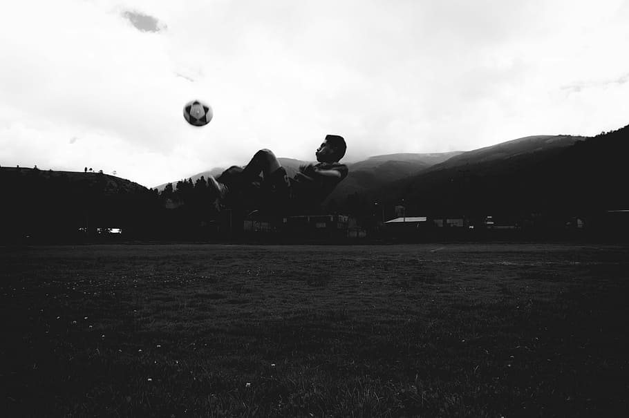 Alto, person kicking soccer ball photo, jump, mountain, grass HD wallpaper