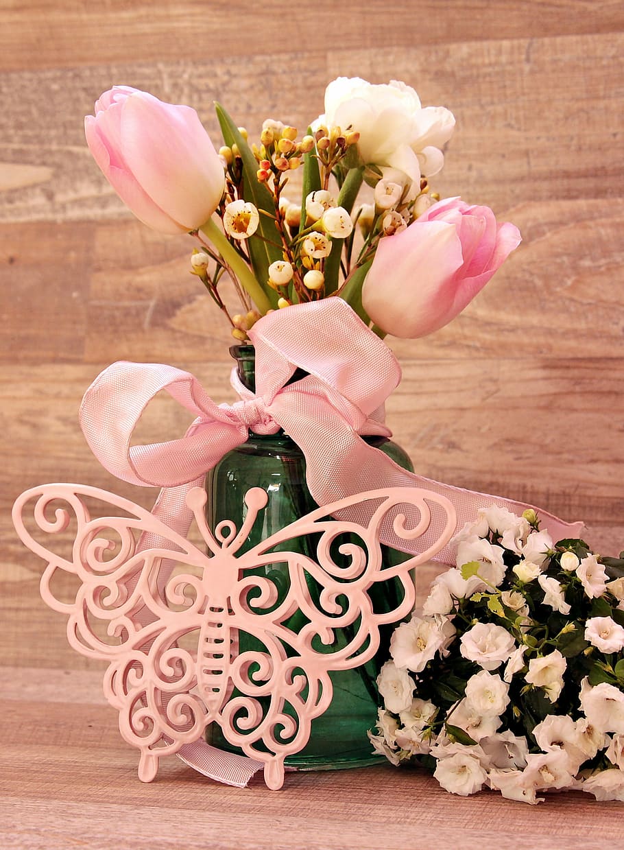 pink tulips with lace decor on tabl, ranunculus, butterfly, vase