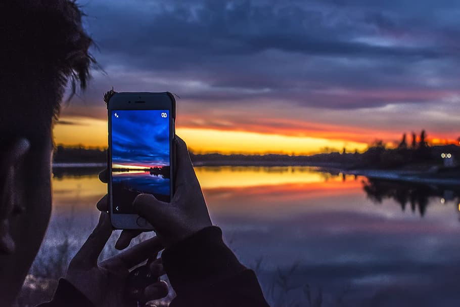 dawn, sky, sunset, person, apple device, backlit, blur, calm waters HD wallpaper