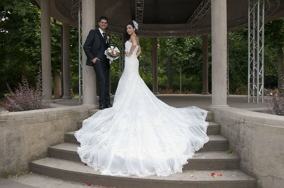 man in black suit standing beside woman wearing white wedding dress, HD wallpaper