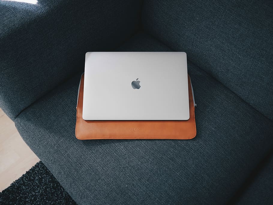 Apple MacBook on blue cushion, silver MacBook, laptop, minimalist