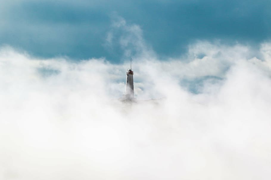 gray concrete lighthouse covered with clouds at daytime, blue HD wallpaper