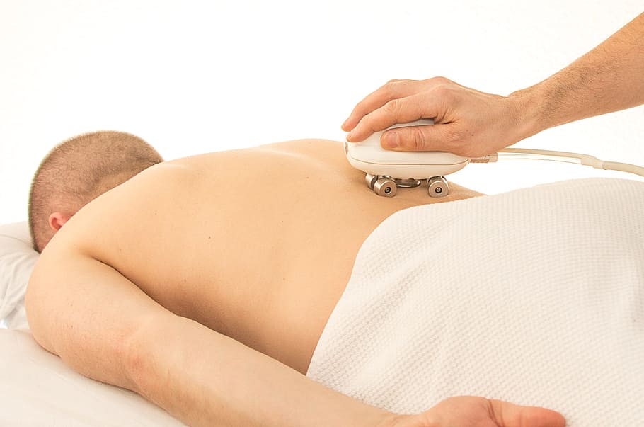 person using palm massager on person's back, Back Pain, Relaxation