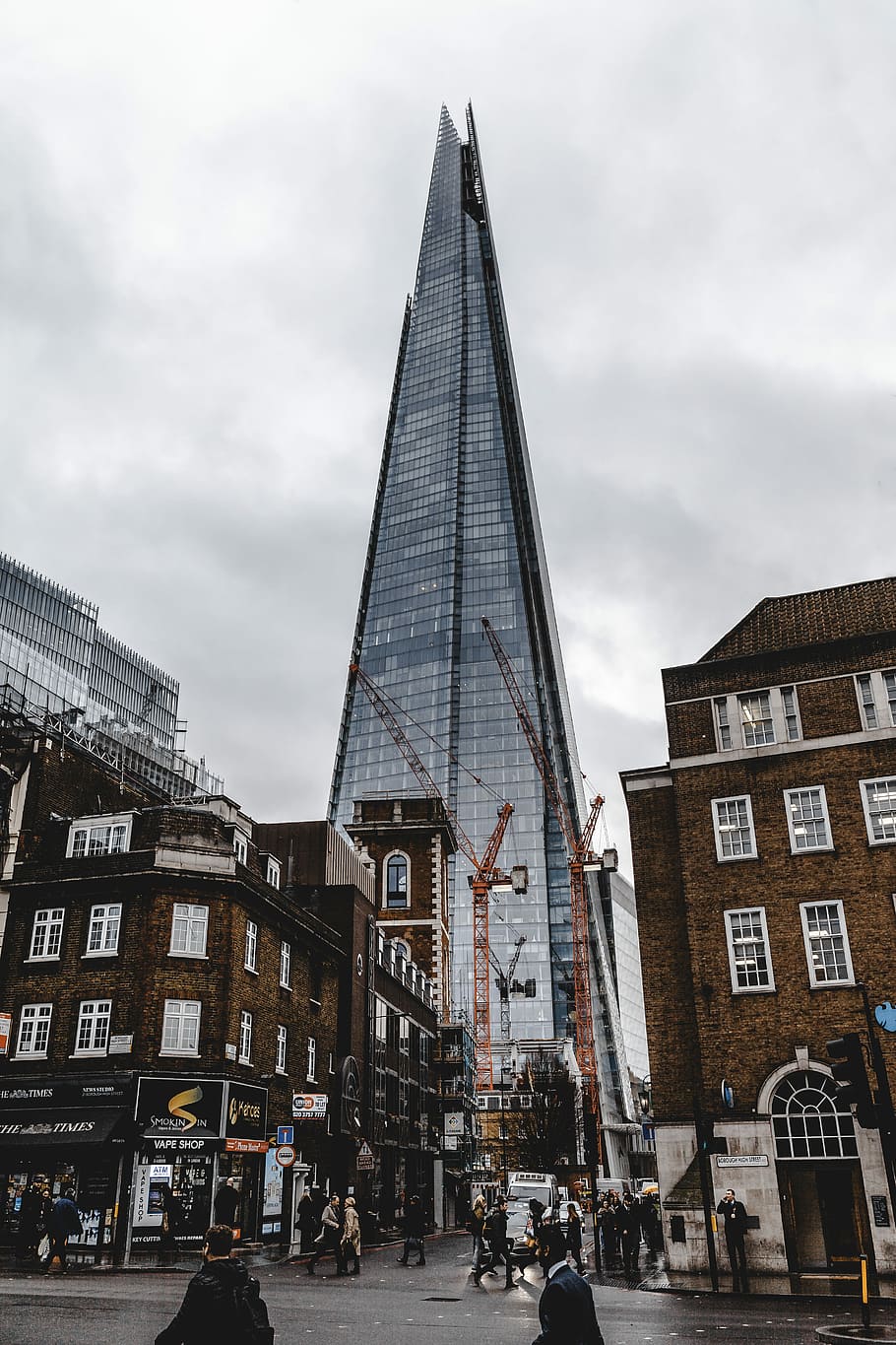 low angle photography of curtain building during daytime, glass high-rise building at cloudy sky HD wallpaper