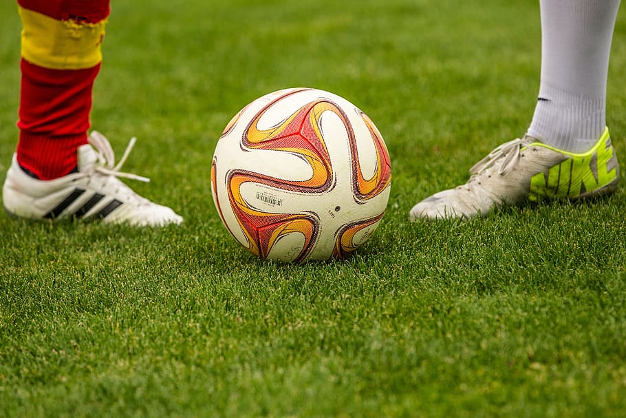 white and red soccer ball in field, football, duel, footballers