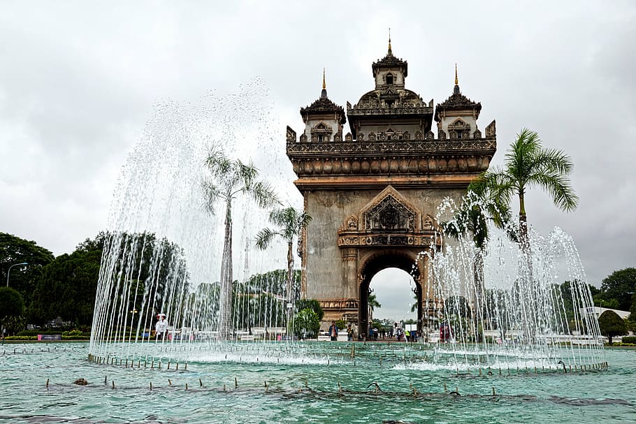 outdoor fountain near gate arch, laos, vientiane, monument, patuxai