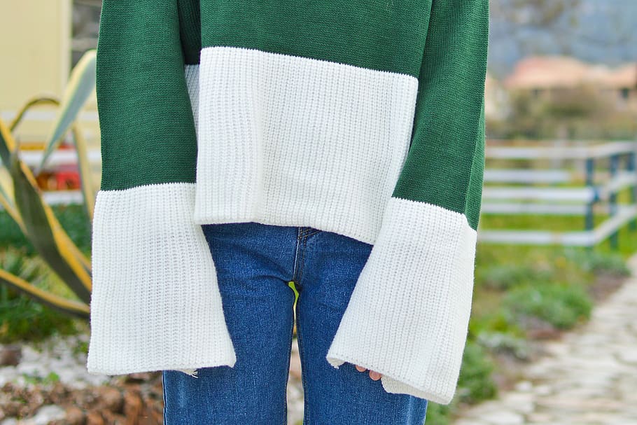 person wearing green and white long-sleeved top and blue denim bottoms, person in green and white striped long-sleeved shirt and blue denim jeans HD wallpaper