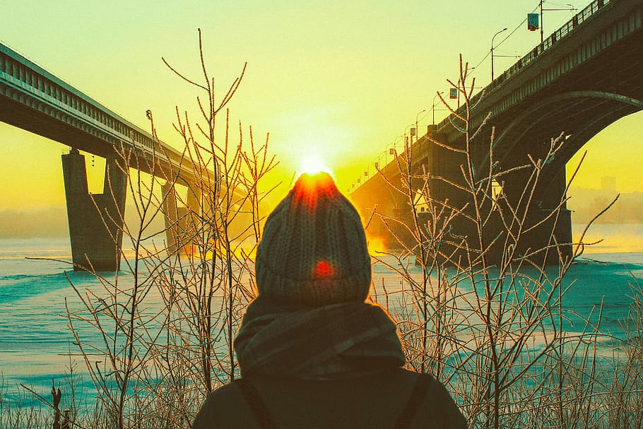 silhouette of person in gray knit cap, person wearing beanies under bridge during sunset HD wallpaper