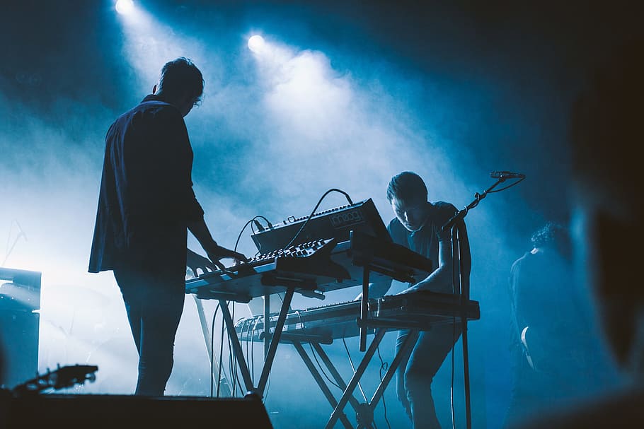 photo of two people using instruments, concert, keyboard, man