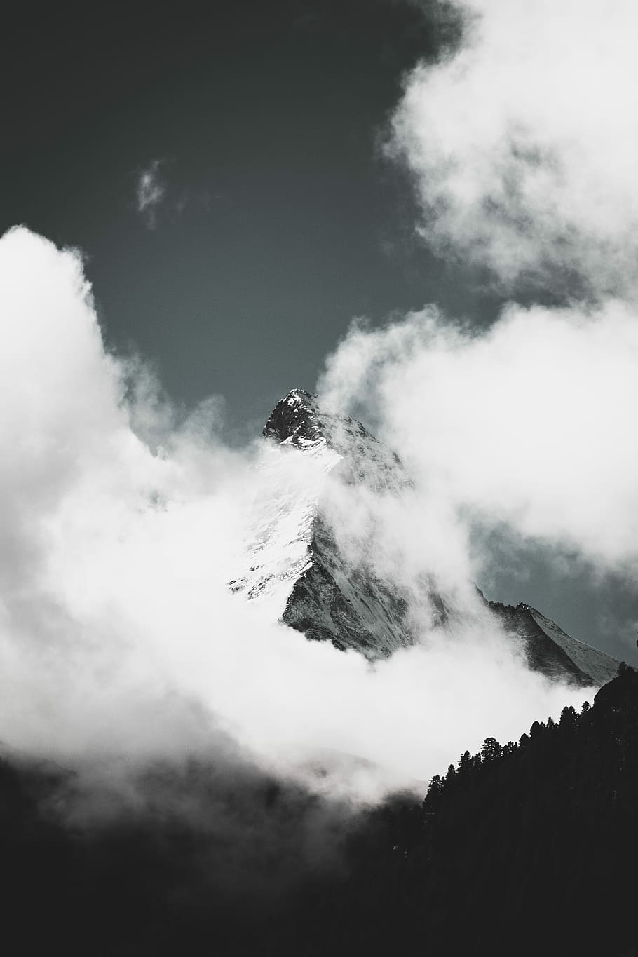 grayscale photo of mountain covered in clouds, gray and black mountain surrounded by clouds HD wallpaper