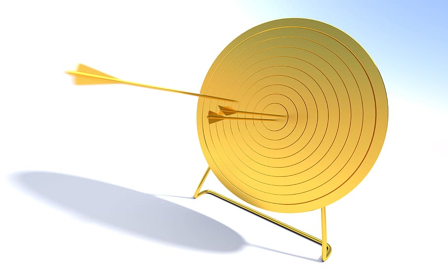 round yellow target board with three arrows, bullseye, goal, aim