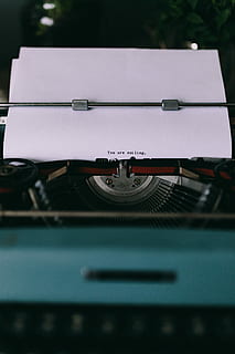 Closeup view of typing quotes on the old typewriter, vintage HD wallpaper