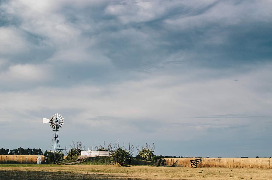white windmill on farm, white wind vane near trees under cloudy sky HD wallpaper