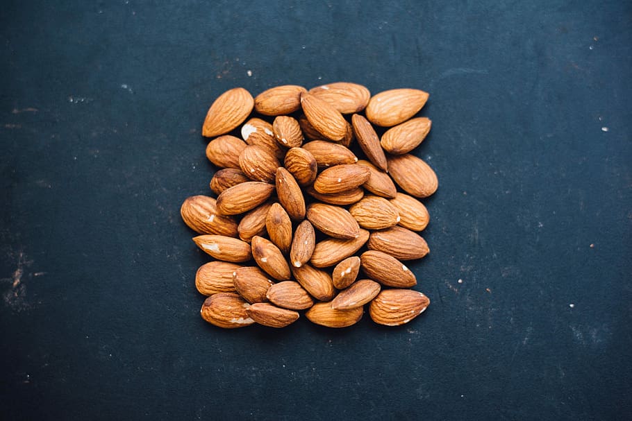 brown nuts on black surface, almonds in flat lay photography HD wallpaper