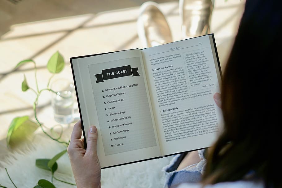 woman reading The Rules book, person opening book, open book HD wallpaper