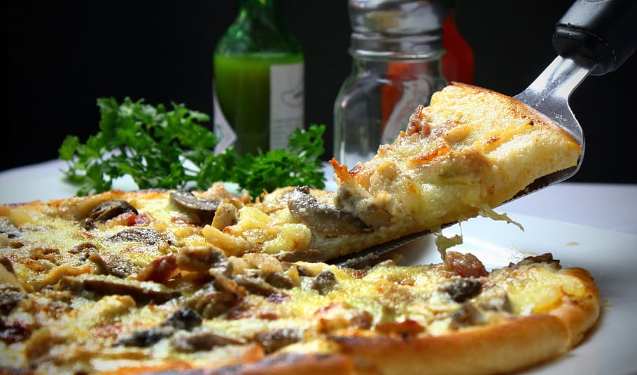 macro photography of pizza with a slice on plate, italian, toppings HD wallpaper