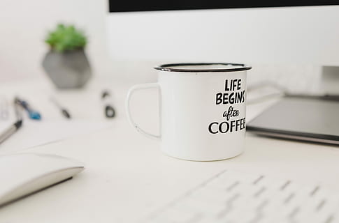 selective focus photo of white mug near wireless mouse, white and black ceramic coffee mug HD wallpaper