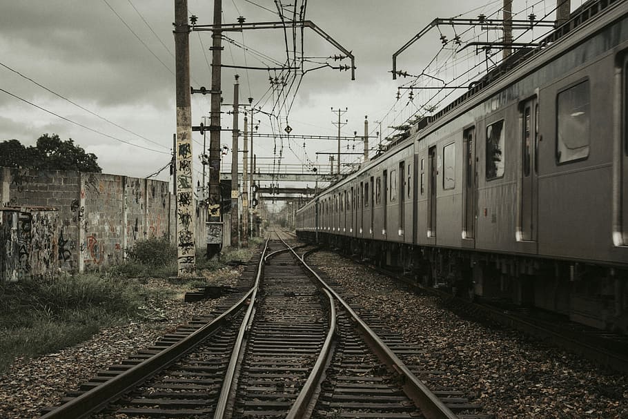 Train station, gray train on railroad, railway, track, wall, rail transportation HD wallpaper