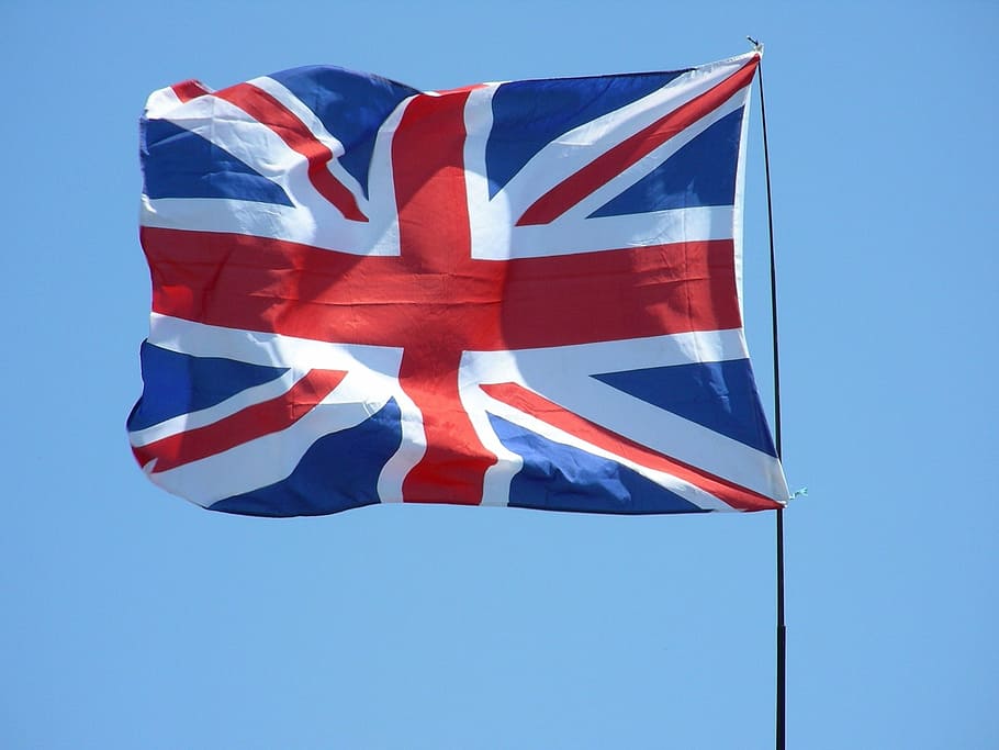 flag of U.K. on pole, union jack, flying, waving, breeze, flag pole