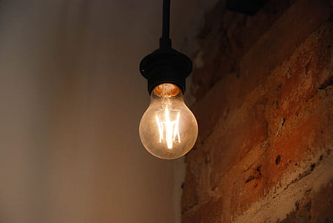 light bulb turned on, lamp, indoors, illuminated, bricks, electricity HD wallpaper