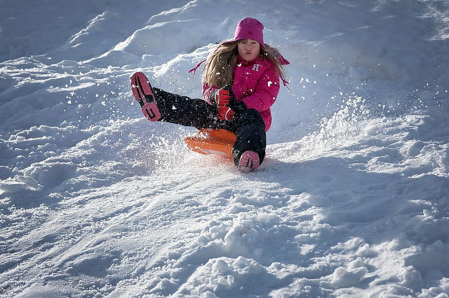 HD wallpaper: woman riding on orange board sliding on snow filled mountain