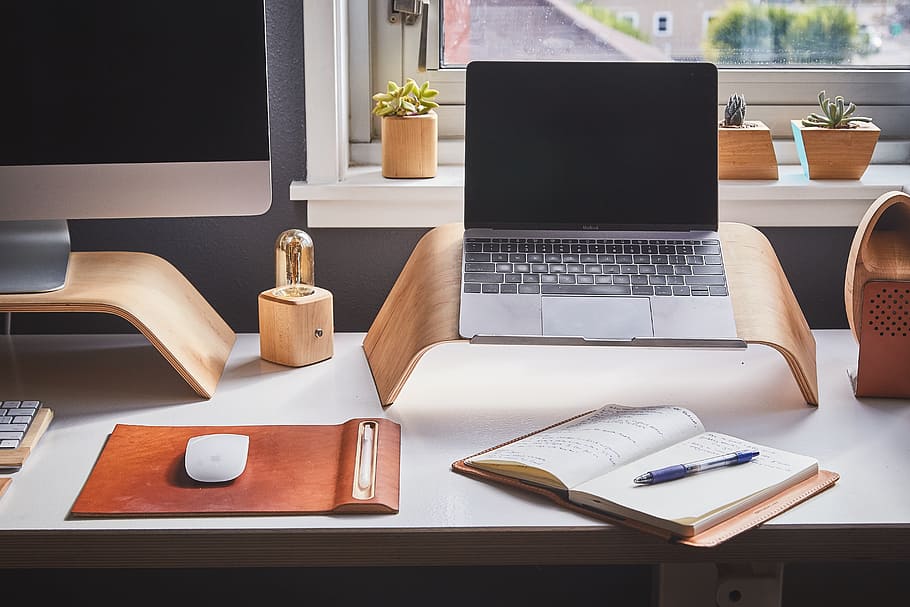 MacBook Pro beside book, laptop, technology, software, monitor HD wallpaper