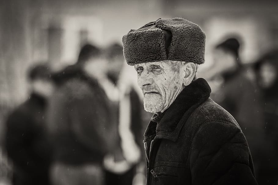 grayscale photo of man wearing snow hat, old age, village, romania
