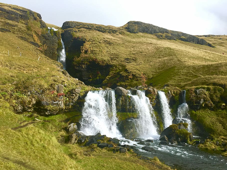 landscape photography of waterfalls, waterfalls near green grass covered mountain HD wallpaper