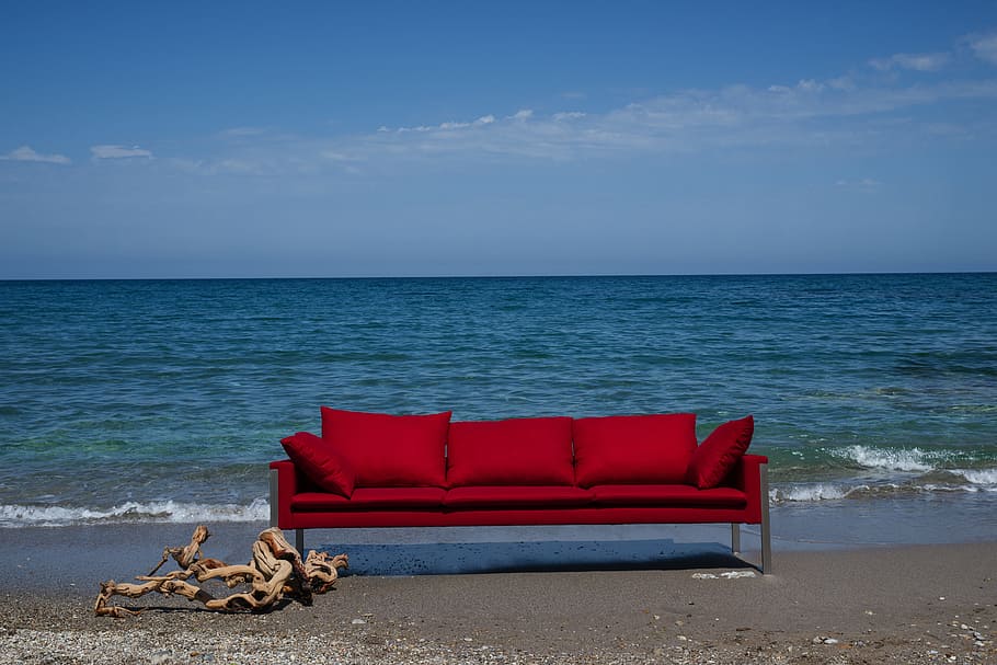 red fabric 3-seat sofa near ocean during daytime, furniture, design, HD wallpaper