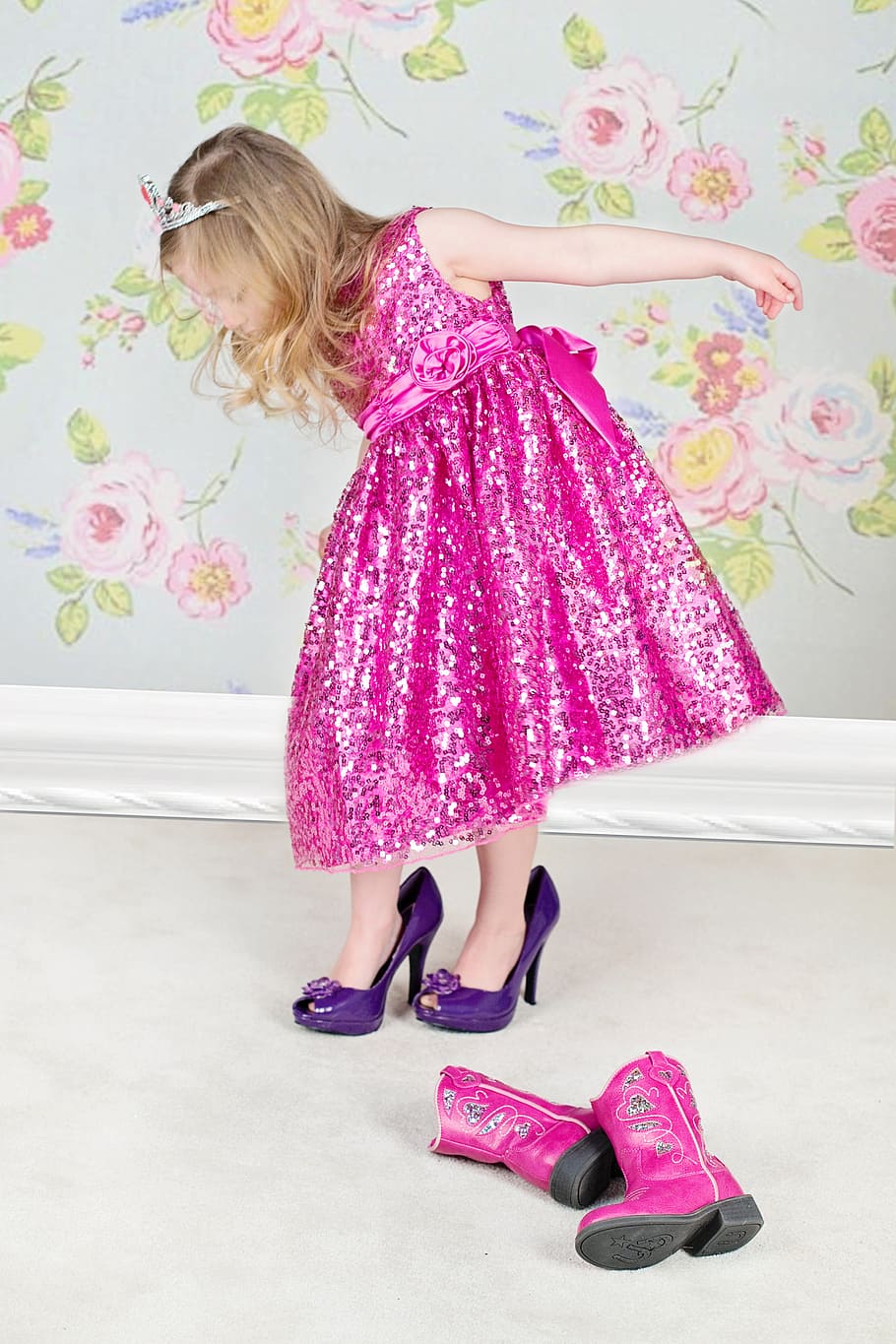 girl fitting a pair of heels, little girl, high heels, pink, dress