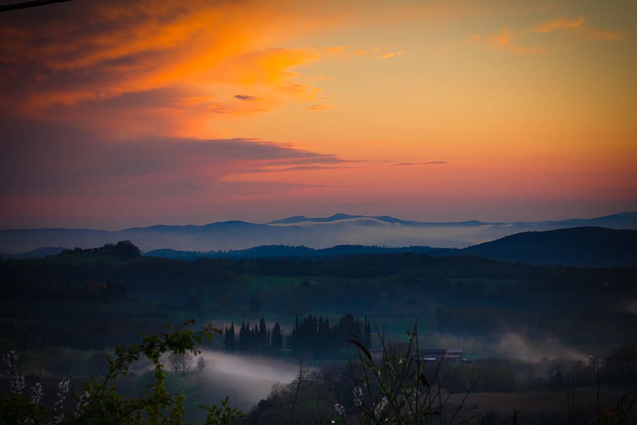 silhouette of mountain during sunset, fogging mountain during golden hour HD wallpaper