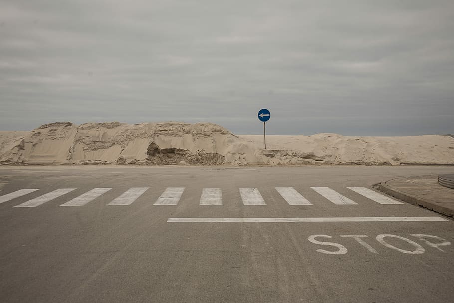 photo of road with pedestrian lane, blue arrow left signage on concrete road HD wallpaper